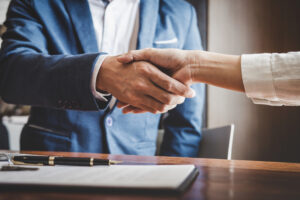 client shaking hands together with a San Jose car accident attorneys helping with San Jose car accidents