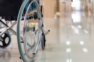 Close up Wheelchairs waiting of patient services. Medical Wheelchairs in the hospital while patient discussing temporary disability benefits and permanent disability benefits for a workers' compensation claim 